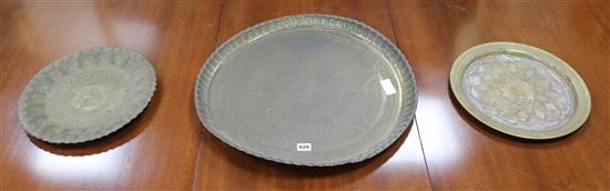 Three Islamic brass dishes, Largest W.55cm